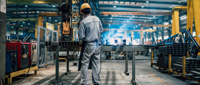 man working inside manufacturing plant