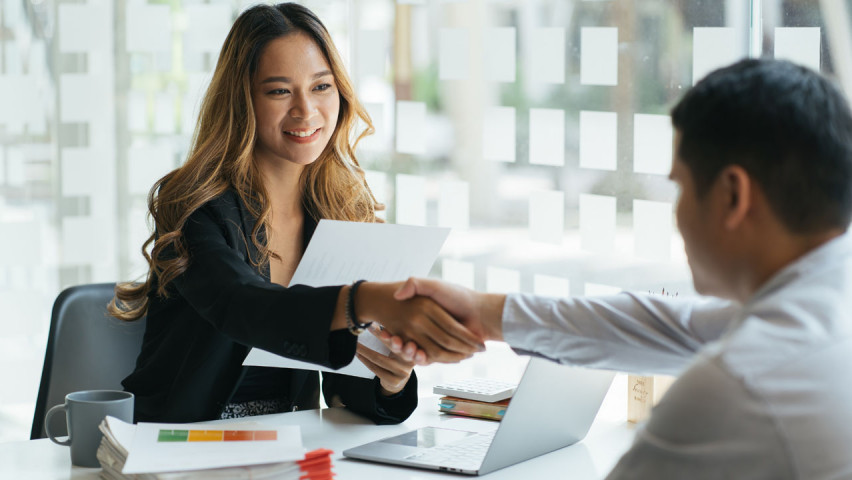 Decorative: Two people shaking hands